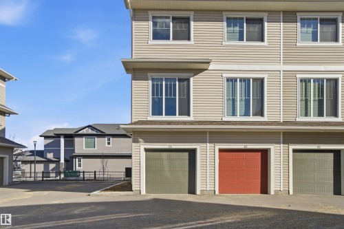 Multi-level residential building featuring light-toned horizontal siding - 64 17832 78 Street, Edmonton, AB - Outdoor With Facade