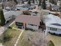 Single-story residence featuring a brown shingle roof and a light-colored facade with dark accent siding - 3912 108 Street, Edmonton, AB  - Outdoor 