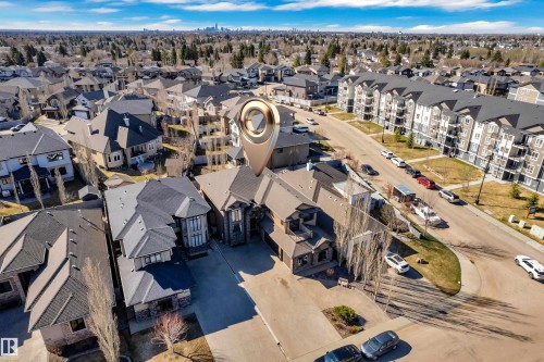Expansive residential property with a multi-level roofline and a stone and stucco exterior - 10915 175 Avenue, Edmonton, AB - Outdoor With View