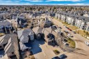 Expansive residential property with a multi-level roofline and a stone and stucco exterior - 10915 175 Avenue, Edmonton, AB  - Outdoor With View 