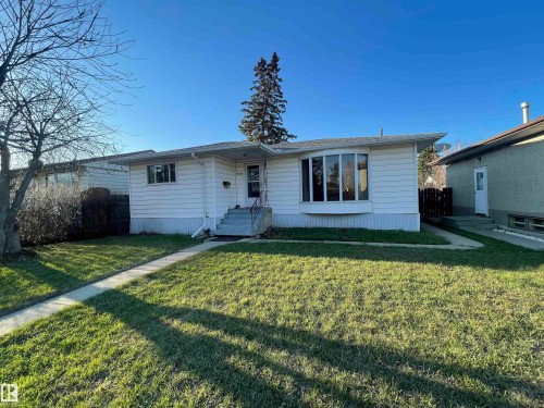 White horizontal siding exterior with a prominent bay window - 13804 132 Avenue, Edmonton, AB - Outdoor