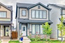 Two-story residence featuring a combination of horizontal siding and stone veneer on the facade - 4609 Alwood Way, Edmonton, AB  - Outdoor With Facade 