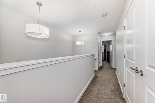 Upper-level hallway featuring neutral wall paint, white trim, and gray carpet flooring - 4609 Alwood Way, Edmonton, AB - Indoor Photo Showing Other Room