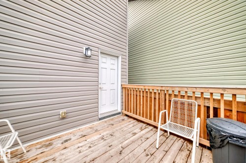 Outdoor deck featuring wood flooring and a natural wood railing - 4609 Alwood Way, Edmonton, AB - Outdoor With Deck Patio Veranda With Exterior