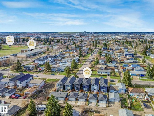 Residential neighborhood featuring a mix of housing styles, established tree-lined streets, and open green spaces - 15731 109 Avenue, Edmonton, AB - Outdoor With View