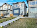 Modern contemporary exterior featuring a distinctive blue and grey facade - 15731 109 Avenue, Edmonton, AB  - Outdoor With Facade 
