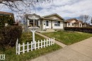 Front of the house with a little "free library" beside the front concrete walkway - 3608 16A Avenue, Edmonton, AB  - Outdoor With Facade 