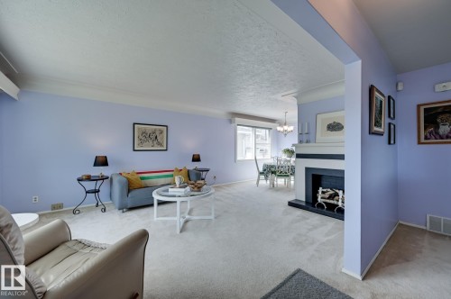 14552 107A Avenue, Edmonton, AB - Indoor Photo Showing Living Room With Fireplace