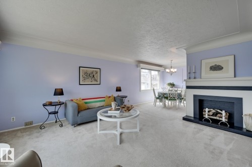14552 107A Avenue, Edmonton, AB - Indoor Photo Showing Living Room With Fireplace
