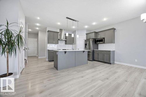 1057 Coopers Hawk Link, Edmonton, AB - Indoor Photo Showing Kitchen With Upgraded Kitchen