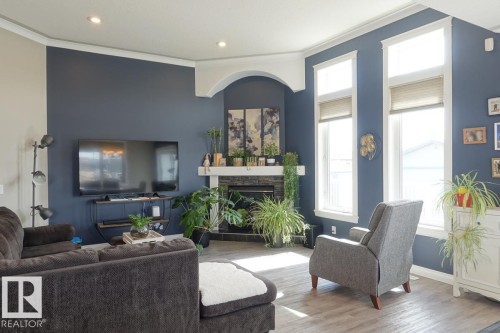 243 Greenfield Way, Fort Saskatchewan, AB - Indoor Photo Showing Living Room With Fireplace