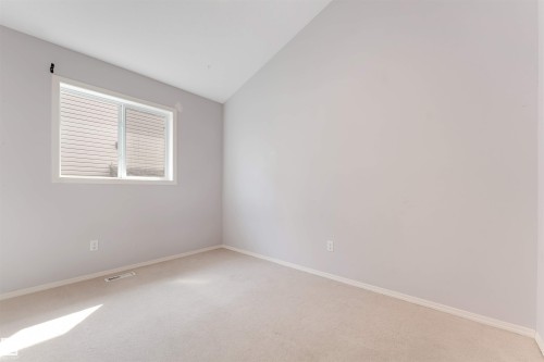 Interior hallway featuring wood-finish flooring, light gray wall paint, and white trim - 123 Rue Masson, Beaumont, AB - Indoor Photo Showing Other Room