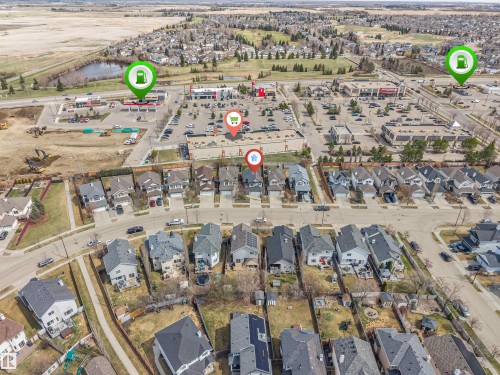 Aerial perspective of a residential neighborhood with varied architectural styles - 123 Rue Masson, Beaumont, AB - Outdoor With View