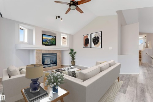 Interior space featuring light wood-finish flooring and vaulted ceilings - 123 Rue Masson, Beaumont, AB - Indoor Photo Showing Other Room