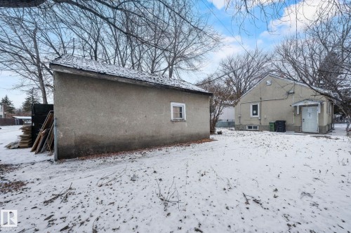 Detached auxiliary building with a single window, set on a snow-covered lot - 11414 85 Street, Edmonton, AB - Outdoor