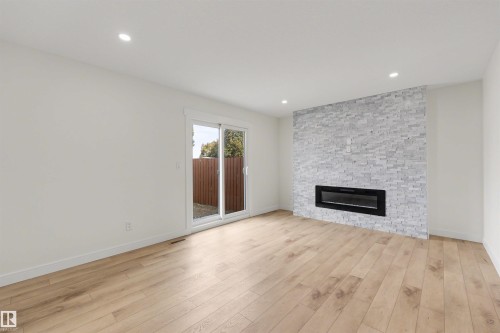 14329 23 Street, Edmonton, AB - Indoor Photo Showing Living Room With Fireplace