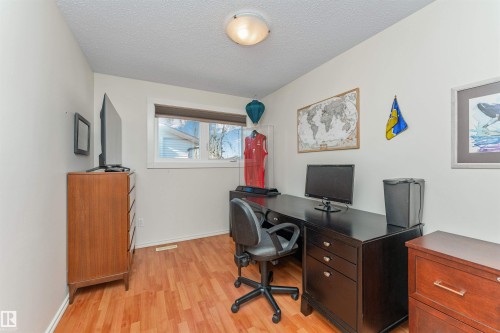 White walls with wood-finish flooring - 49 Ash Crescent, St. Albert, AB - Indoor Photo Showing Office