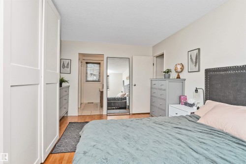 Hardwood-style flooring throughout - 49 Ash Crescent, St. Albert, AB - Indoor Photo Showing Bedroom