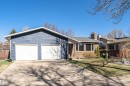 Ranch-style residence featuring blue horizontal siding and a two-car garage - 49 Ash Crescent, St. Albert, AB  - Outdoor 