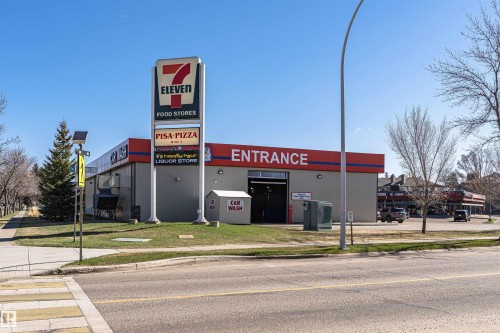 Commercial building featuring a prominent 7-Eleven sign, Pisa Pizza signage, and a liquor store sign - 49 Ash Crescent, St. Albert, AB - Outdoor