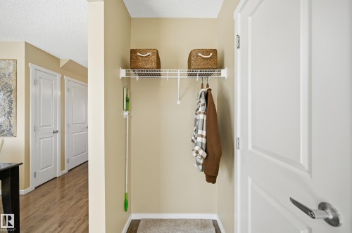 Entryway featuring a white wire shelving unit, providing storage and hanging space - 481 Sheppard Boulevard, Leduc, AB - Indoor Photo Showing Other Room