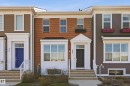 Brick facade with multiple windows, prominent entryway, and bay window - 481 Sheppard Boulevard, Leduc, AB  - Outdoor With Facade 