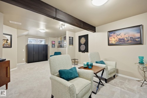 Spacious room featuring light-toned carpeting and neutral wall paint - 481 Sheppard Boulevard, Leduc, AB - Indoor