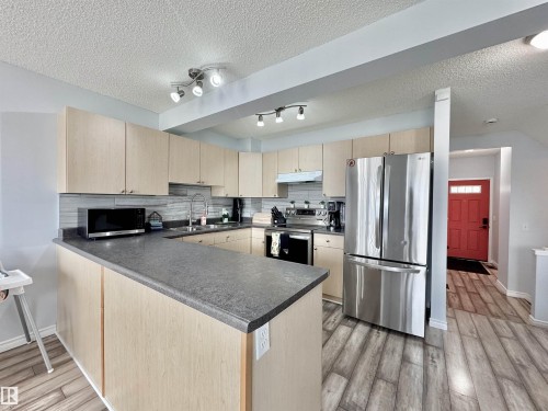 51 Galloway Wynd, Fort Saskatchewan, AB - Indoor Photo Showing Kitchen With Double Sink