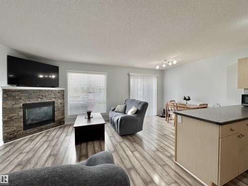 51 Galloway Wynd, Fort Saskatchewan, AB - Indoor Photo Showing Living Room With Fireplace