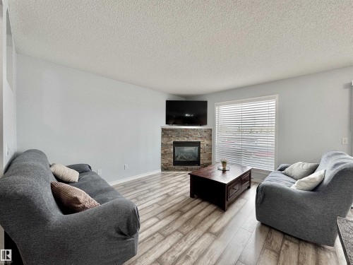 51 Galloway Wynd, Fort Saskatchewan, AB - Indoor Photo Showing Living Room With Fireplace