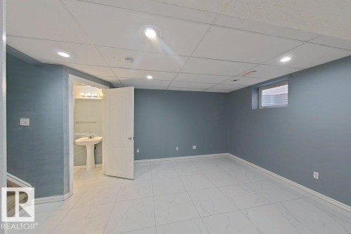 Room featuring light-colored walls, recessed lighting, and a window with blinds - 3347 24 Avenue, Edmonton, AB - Indoor Photo Showing Other Room