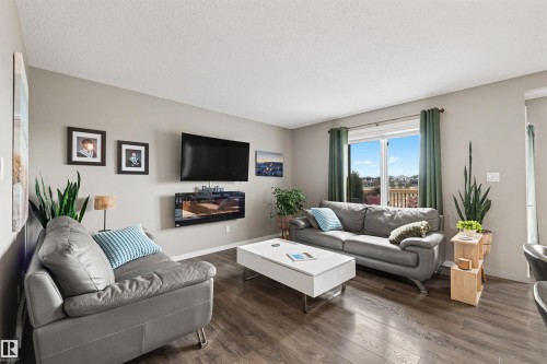 6517 57 Avenue, Beaumont, AB - Indoor Photo Showing Living Room With Fireplace