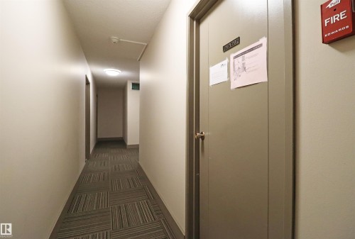 Corridor featuring patterned carpet flooring, recessed ceiling lighting, and light-toned walls - 901 10160 116 Street, Edmonton, AB - Indoor Photo Showing Other Room