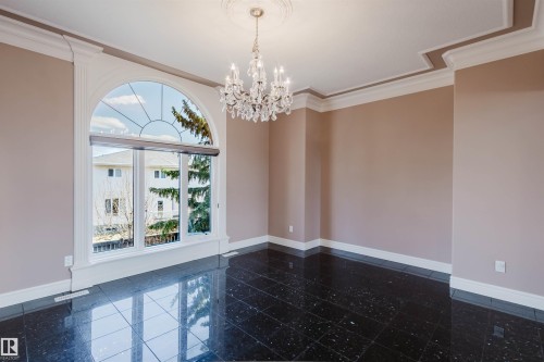 Grand arched window with decorative muntins - 2408 Tegler Green, Edmonton, AB - Indoor Photo Showing Other Room