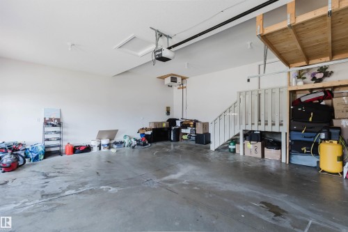 Spacious garage featuring concrete flooring and white painted walls - 2408 Tegler Green, Edmonton, AB - Indoor Photo Showing Garage