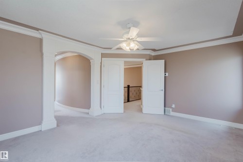 Spacious room featuring light-toned carpeting and neutral wall paint - 2408 Tegler Green, Edmonton, AB - Indoor Photo Showing Other Room