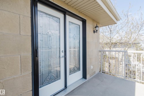 Private balcony featuring a concrete surface and a metal railing - 2408 Tegler Green, Edmonton, AB - Outdoor With Balcony With Exterior