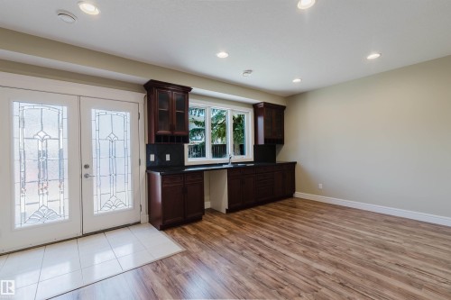 Spacious interior featuring wood-finish flooring, recessed lighting, and light-toned walls - 2408 Tegler Green, Edmonton, AB - Indoor Photo Showing Other Room