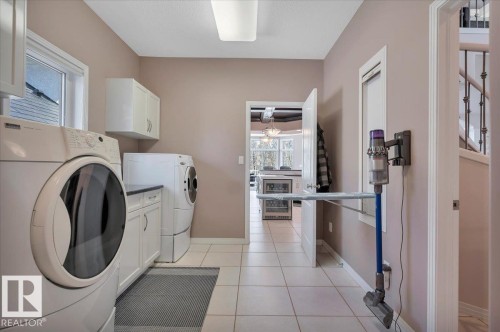 TAKE NOTE OF THE FOLD OUT IRONING BOARD! - 314 Weaver Point(E), Edmonton, AB - Indoor Photo Showing Laundry Room