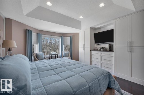 WITH CUSTOM WARDROBE / DRESSER UNIT BY FULL HOUSE RENOVATIONS - 314 Weaver Point(E), Edmonton, AB - Indoor Photo Showing Bedroom