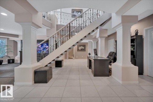 FLEX SPACE BEHIND THE STAIRCASE CURRENTLY USED AS AN OFFICE. COULD ALSO BE USED AS A WINE TASTING ARE OR OPEN TO YOUR IMAGINATION - 314 Weaver Point(E), Edmonton, AB - Indoor Photo Showing Other Room