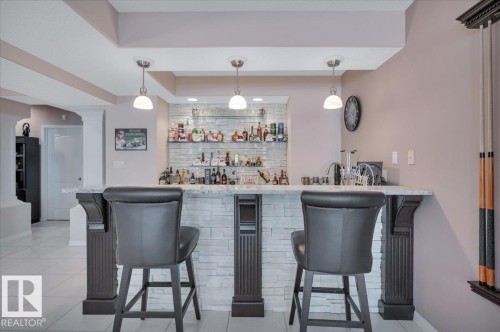 CUSTOM BAR WITH FLOATING SHELVES BUILT BY FULL HOUSE RENOVATIONS - 314 Weaver Point(E), Edmonton, AB - Indoor Photo Showing Dining Room