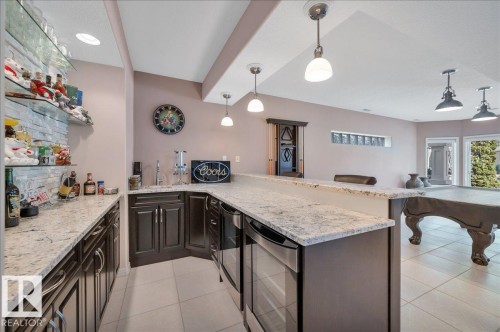 WITH SILGRANITE SINK AND 2 GE PROFILE BEVERAGE CENTRES - 314 Weaver Point(E), Edmonton, AB - Indoor Photo Showing Kitchen