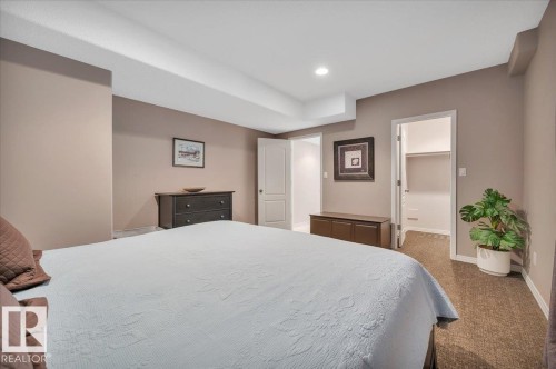 FIRST OF 2 LOWER LEVEL BEDROOMS, THIS WITH A WALK IN CLOSET - 314 Weaver Point(E), Edmonton, AB - Indoor Photo Showing Bedroom