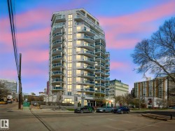 Contemporary high-rise building featuring multiple levels of private balconies with glass railings - 
