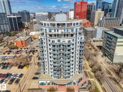 High-rise residential building featuring multiple levels of curved balconies - 
