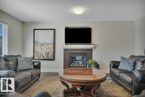 13 Selkirk Place, Leduc, AB - Indoor Photo Showing Living Room With Fireplace