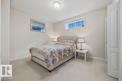 Carpeted room featuring a single window with white trim, light-toned walls, and white baseboards - 11551 14 Avenue, Edmonton, AB - Indoor Photo Showing Bedroom