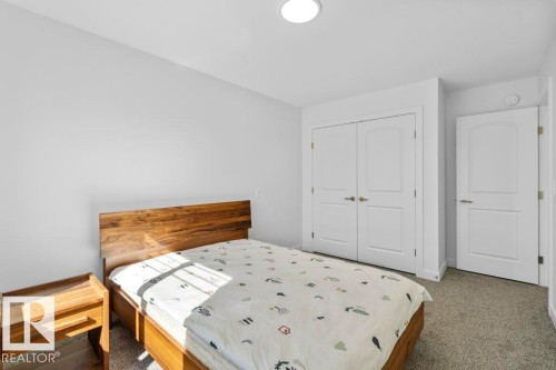 Carpeted room with a flush-mount ceiling light - 19110 20A Avenue, Edmonton, AB - Indoor Photo Showing Bedroom