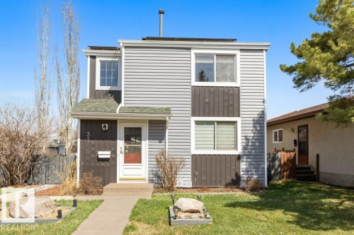 Two-story residence featuring gray horizontal siding and dark brown vertical siding accents - 3736 12 Avenue, Edmonton, AB - Outdoor